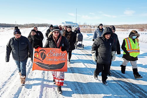 Rolling River First Nation residents participate in a march Tuesday to draw attention to family violence in the community. A lunch was served prior to the march and speakers discussed family violence issues and resources afterward. (Tim Smith/The Brandon Sun)