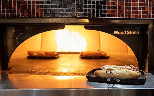 JESSICA LEE / WINNIPEG FREE PRESS
Sandwiches toast in the oven at Stonework’s Bistro on January 24, 2023. The fast-casual eatery is owned by Chef Mike Publicover and opened in May 2022 at Winnipeg Square.
Reporter: Dave Sanderson