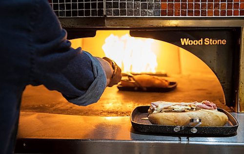 JESSICA LEE / WINNIPEG FREE PRESS

Sandwiches toast in the oven at Stonework&#x2019;s Bistro on January 24, 2023. The fast-casual eatery is owned by Chef Mike Publicover and opened in May 2022 at Winnipeg Square.

Reporter: Dave Sanderson