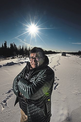 PHIL HOSSACK / WINNIPEG FREE PRESS - Michael Lawrenchuk poses at the 'end of the road' where Provincial Highway #290 ends North of Fox Lake. The farthest point north driveable in Manitoba. Melissa Martin Story. Feb 6, 2019