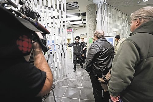 RUTH BONNEVILLE / WINNIPEG FREE PRESS 

Local - Library opens

Security personal check for dangerous metal objects on being carried by library users on the first day of the Millennium Library opening Monday.  Lineups formed during the first 45 mins due to the security checks.


See story.
Jan 23rd,  2023