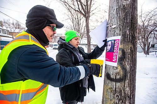 MIKAELA MACKENZIE / WINNIPEG FREE PRESS

Bear Clan members Lorne Proutt and C.J. Sinclair put up posters on McMicken Street during a search and awareness campaign for Ashlee Shingoose in the West End in Winnipeg on Wednesday, Jan. 25, 2023. For Chris story.

Winnipeg Free Press 2023.