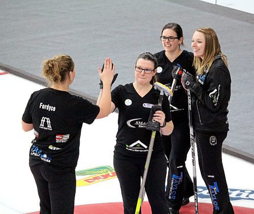 Alyssa Calvert's rink celebrates after their upset win over Darcy Robertson at the Manitoba Scotties Tournament of Hearts in Carberry in December 2021. The team is back at this week's event in East St. Paul. (Lucas Punkari/The Brandon Sun)