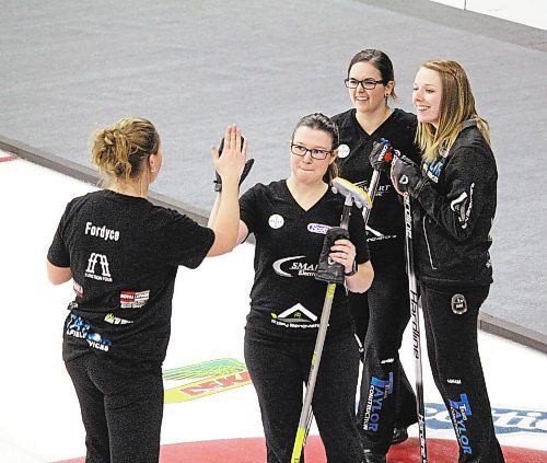 Brandon Sun Alyssa Calvert's rink celebrates after their upset win over Darcy Robertson on Friday afternoon at the 2022 Manitoba Scotties Tournament of Hearts in Carberry. (Lucas Punkari/The Brandon Sun)