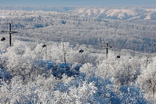 Skiers and snowboarders ride a chairlift, framed by hoar frost, during a crisp day of winter activities at Asessippi Ski Resort on Tuesday. (Tim Smith/The Brandon Sun)