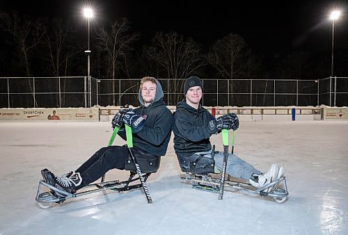 JESSICA LEE / WINNIPEG FREE PRESS

Isaiah Arnbruster (left), 18 and his brother Luke, 19, pose with their sledge sticks at the Dakota Community Centre on January 25, 2023.

Reporter: Dave Sanderson