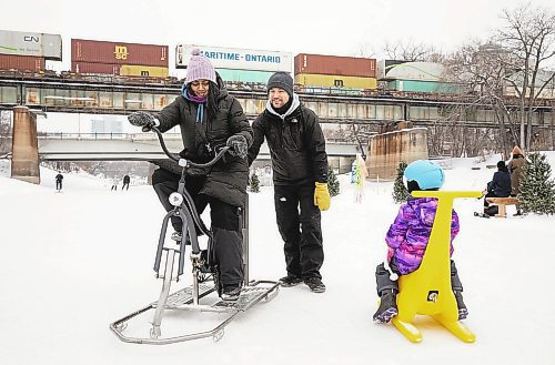 JESSICA LEE / WINNIPEG FREE PRESS

AV Kitching tries an ice-bike while husband Chris Kitching gives her a push to help her get started at The Forks on January 20, 2023.

Reporter: AV Kitching