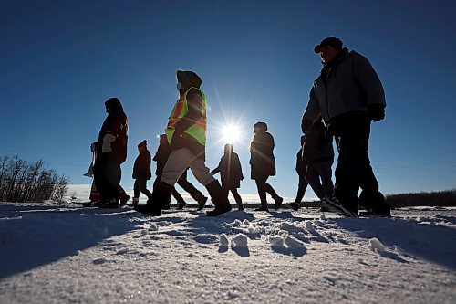 Community members from Rolling River First Nation take part in a march against family violence in the community on Tuesday to draw attention to family violence in the community. (Tim Smith/The Brandon Sun)