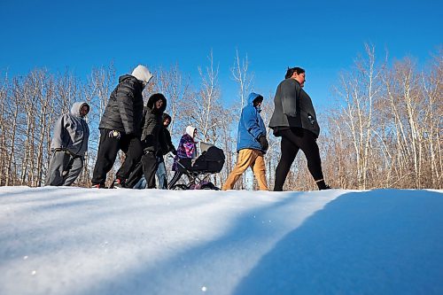 Community members from Rolling River First Nation take part in a march against family violence in the community on Tuesday to draw attention to family violence in the community. (Tim Smith/The Brandon Sun)
