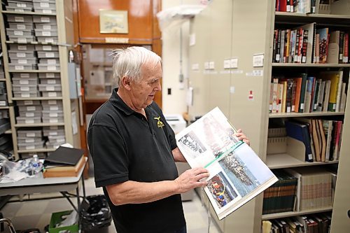 Ted Krasicki, researcher at the 26th Field Regiment RCA/XII Manitoba Dragoons Museum, looks through the book "The Way We Were" at the museum late last month. He says the City of Brandon should find a way to honour Corp. Walter John Klos. (Tim Smith/The Brandon Sun)