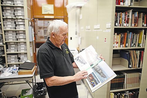 26012023
Ted Krasicki, Researcher at the 26th Field Regiment RCA/XII Manitoba Dragoons Museum, looks through the book The Way We Were at the museum on Tuesday. (Tim Smith/The Brandon Sun)