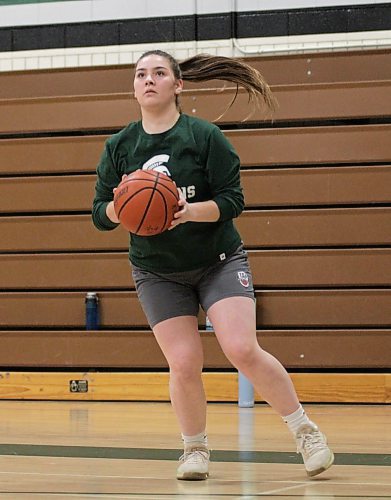 Dani Black sets to shoot a three-pointer during Neelin Spartans varsity girls basketball practice on Wednesday. The senior has taken on a big role on both ends of the floor. (Thomas Friesen/The Brandon Sun)