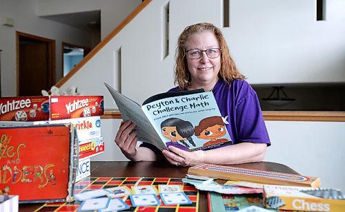 RUTH BONNEVILLE / WINNIPEG FREE PRESS
LOCAL - math anxiety
Portrait of Sheri-Lynn Skwarchuk, co-author of the new math book, a professor at UWinnipeg and founder of ToyBox, with her new new book and games that help kids develop math skills.
MATH ANXIETY: A Winnipeg professor has penned a new children's book that aims to equip parents and teachers with strategies to tackle math anxiety. Sheri-Lynn Skwarchuk of the University of Winnipeg and Erin Maloney, a cognitive scientist out of the University of Ottawa, published Peyton and Charlie Challenge Math. Last week, LRSD hosted Maloney for a talk about math anxiety and strategies to address it.
See Maggie's story.
Jan 26th, 2023