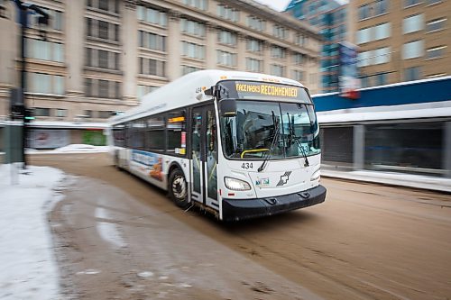 MIKE DEAL / WINNIPEG FREE PRESS
A Winnipeg Transit bus drives along Graham Avenue Thursday afternoon.
230126 - Thursday, January 26, 2023.