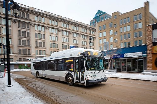 MIKE DEAL / WINNIPEG FREE PRESS
A Winnipeg Transit bus drives along Graham Avenue Thursday afternoon.
230126 - Thursday, January 26, 2023.