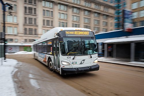 MIKE DEAL / WINNIPEG FREE PRESS
A Winnipeg Transit bus drives along Graham Avenue Thursday afternoon.
230126 - Thursday, January 26, 2023.