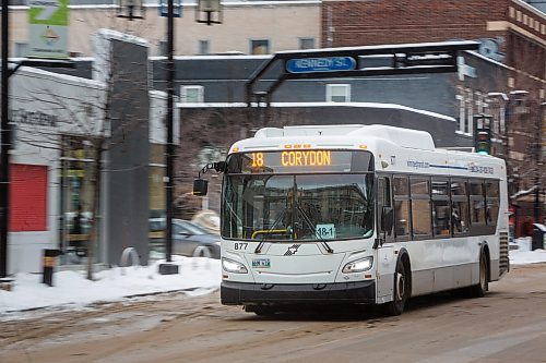 MIKE DEAL / WINNIPEG FREE PRESS
A Winnipeg Transit bus drives along Graham Avenue Thursday afternoon.
230126 - Thursday, January 26, 2023.