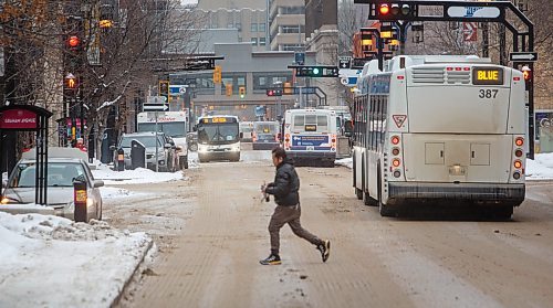 MIKE DEAL / WINNIPEG FREE PRESS
A Winnipeg Transit bus drives along Graham Avenue Thursday afternoon.
230126 - Thursday, January 26, 2023.