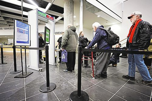 RUTH BONNEVILLE / WINNIPEG FREE PRESS
Local - Library opens
Security personal check for dangerous metal objects on being carried by library users on the first day of the Millennium Library opening Monday. Lineups formed during the first 45 mins due to the security checks.
See story.
Jan 23rd, 2023