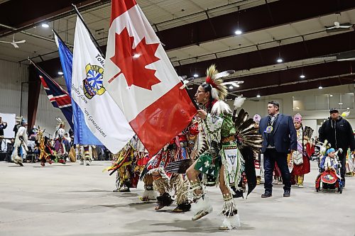 Dancers and dignitaries take part in the powwow grand entry at the Dakota Nation Winterfest at the Keystone Centre on Friday evening. (Tim Smith/The Brandon Sun)