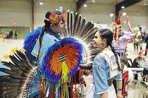 27012022
Elijah Waditaka and Delphine Zorthian visit at the Dakota Nation Winterfest at the Keystone Centre on Friday evening. After cancellations in 2021 and 2022 due to the COVID-19 pandemic, the annual event is back in the wheat city until Sunday and features a powwow, a talent show, hockey, volleyball and basketball tournaments, and much more. 
(Tim Smith/The Brandon Sun)