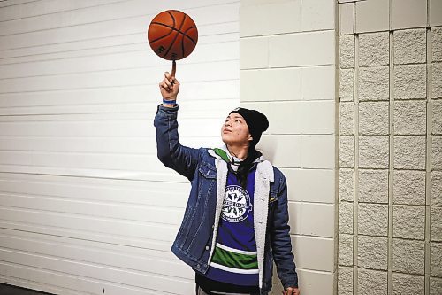 27012022
Labron Chartrand of Skownan First Nation spins a basketball on his finger during the Dakota Nation Winterfest at the Keystone Centre on Friday evening. After cancellations in 2021 and 2022 due to the COVID-19 pandemic, the annual event is back in the wheat city until Sunday and features a powwow, a talent show, hockey, volleyball and basketball tournaments, and much more. 
(Tim Smith/The Brandon Sun)