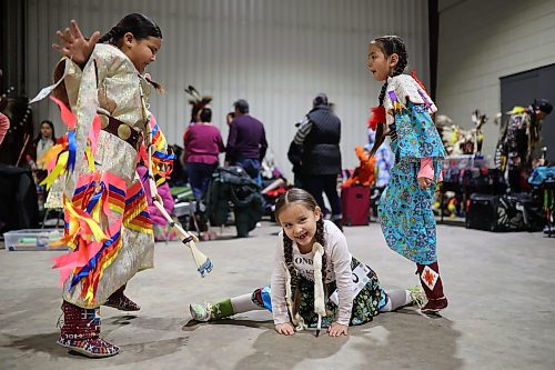 27012022
Jovi Keewatin and Meeka Hall dance while Sophia Halfe does the splits as they wait for the powwow grand entry to commence on the opening evening of the Dakota Nation Winterfest at the Keystone Centre on Friday evening. After cancellations in 2021 and 2022 due to the COVID-19 pandemic, the annual event is back in the wheat city until Sunday and features a powwow, a talent show, hockey, volleyball and basketball tournaments, and much more. 
(Tim Smith/The Brandon Sun)