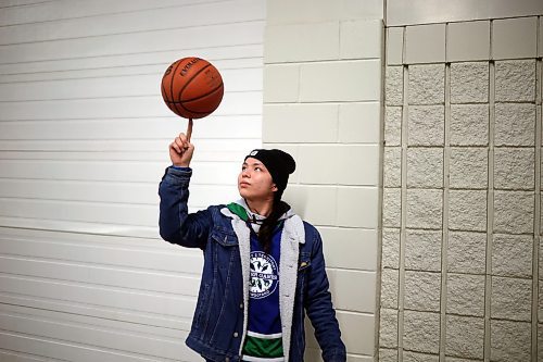 27012022
Labron Chartrand of Skownan First Nation spins a basketball on his finger during the Dakota Nation Winterfest at the Keystone Centre on Friday evening. After cancellations in 2021 and 2022 due to the COVID-19 pandemic, the annual event is back in the wheat city until Sunday and features a powwow, a talent show, hockey, volleyball and basketball tournaments, and much more. 
(Tim Smith/The Brandon Sun)
