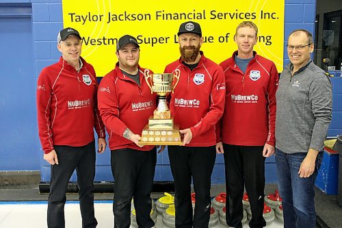 Lead Geoff Trimble, left, second Austin Mustard, third Eric Zamrykut and skip Jeff Stewart receive the Taylor Jackson Financial Services Westman Super League of Curling championship trophy from Shawn Taylor on Sunday afternoon after their 6-3 win over Steve Irwin (Photos by Lucas Punkari/The Brandon Sun)