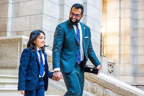 MIKAELA MACKENZIE / WINNIPEG FREE PRESS

Obby Khan, new minister responsible for sport, culture and heritage, minister responsible for the Manitoba Centennial Centre Corp. and minister responsible for Travel Manitoba, walks down the stairs with his son, Sufiyan Morrish-Khan (ten), after being sworn in as the first Muslim cabinet minister in Manitoba at the Manitoba Legislative Building in Winnipeg on Monday, Jan. 30, 2023. For Carol/Danielle story.

Winnipeg Free Press 2023.