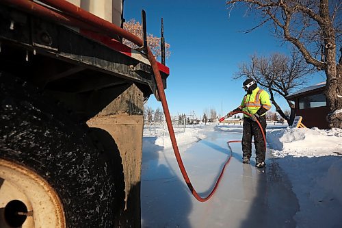 30012023
Abigail Longman with the City of Brandon Parks &amp; Recreation department floods the Brandon Skating Oval with water as part of maintenance for the skating rink while her coworker Chris Murphy drives the water truck on a bitterly cold Monday afternoon. 
(Tim Smith/The Brandon Sun)