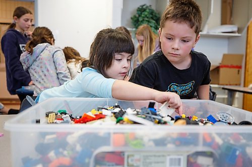 MIKE DEAL / WINNIPEG FREE PRESS
Starbuck School students playing with lego during the noon-hour Lego Club, (l-r) Lily Turner, and Cale Schrof.
Tim Morison, phys-ed teacher at Starbuck School in Starbuck, MB, found in Lego an unlikely cure to workplace burnout and mental health challenges, which began after months of teaching during a pandemic and worsened when he and his wife lost their baby in the spring. Morison opened up to his students about his mental health struggles and shared his coping mechanism: building Lego with his three-year-old at home and alone, with them. His students&#x560;receptiveness has since sparked the launch of a Lego club at Starbuck School. On Mondays and Tuesdays, the phys-ed teacher forfeits his lunch hour to spend time with K-8 students and colourful blocks. They&#x576;e done significant fundraising to purchase toys and accepted donations from community members.
See Maggie Macintosh story
230130 - Monday, January 30, 2023.