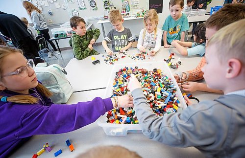 MIKE DEAL / WINNIPEG FREE PRESS
Starbuck School students playing with lego during the noon-hour Lego Club, (clockwise from bottom left) Jaidyn Smart, Wayne Marks, Bentley Manaigre, Taylor Harding, Everett Mosset, Lily Turner, Cale Schrof, and Ryker Milne. 
Tim Morison, phys-ed teacher at Starbuck School in Starbuck, MB, found in Lego an unlikely cure to workplace burnout and mental health challenges, which began after months of teaching during a pandemic and worsened when he and his wife lost their baby in the spring. Morison opened up to his students about his mental health struggles and shared his coping mechanism: building Lego with his three-year-old at home and alone, with them. His students&#x560;receptiveness has since sparked the launch of a Lego club at Starbuck School. On Mondays and Tuesdays, the phys-ed teacher forfeits his lunch hour to spend time with K-8 students and colourful blocks. They&#x576;e done significant fundraising to purchase toys and accepted donations from community members.
See Maggie Macintosh story
230130 - Monday, January 30, 2023.