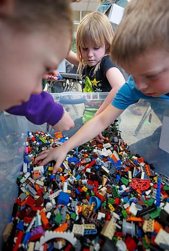 MIKE DEAL / WINNIPEG FREE PRESS
Starbuck School students playing with lego during the noon-hour Lego Club, (l-r) Everett Mosset, Ella Milne, and Carter Schrof.
Tim Morison, phys-ed teacher at Starbuck School in Starbuck, MB, found in Lego an unlikely cure to workplace burnout and mental health challenges, which began after months of teaching during a pandemic and worsened when he and his wife lost their baby in the spring. Morison opened up to his students about his mental health struggles and shared his coping mechanism: building Lego with his three-year-old at home and alone, with them. His studentsՠreceptiveness has since sparked the launch of a Lego club at Starbuck School. On Mondays and Tuesdays, the phys-ed teacher forfeits his lunch hour to spend time with K-8 students and colourful blocks. Theyնe done significant fundraising to purchase toys and accepted donations from community members.
See Maggie Macintosh story
230130 - Monday, January 30, 2023.