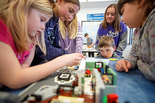 MIKE DEAL / WINNIPEG FREE PRESS
Starbuck School students playing with lego during the noon-hour Lego Club, (l-r) Lennon Thompson, Vasiliki Storozuk, Rylee Winkler, Bella Winkler, Quinn Rasmussen.
Tim Morison, phys-ed teacher at Starbuck School in Starbuck, MB, found in Lego an unlikely cure to workplace burnout and mental health challenges, which began after months of teaching during a pandemic and worsened when he and his wife lost their baby in the spring. Morison opened up to his students about his mental health struggles and shared his coping mechanism: building Lego with his three-year-old at home and alone, with them. His studentsՠreceptiveness has since sparked the launch of a Lego club at Starbuck School. On Mondays and Tuesdays, the phys-ed teacher forfeits his lunch hour to spend time with K-8 students and colourful blocks. Theyնe done significant fundraising to purchase toys and accepted donations from community members.
See Maggie Macintosh story
230130 - Monday, January 30, 2023.