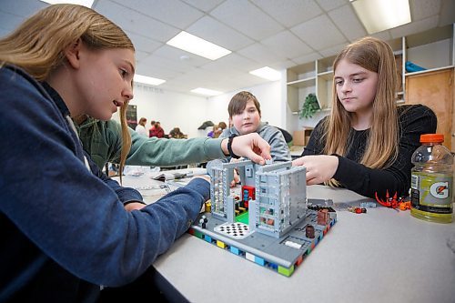 MIKE DEAL / WINNIPEG FREE PRESS
Starbuck School students playing with lego during the noon-hour Lego Club, (l-r) Emily Manaigre, Abby Zulyniak, Nicholas Lyssiakov, and Sara Fossay.
Tim Morison, phys-ed teacher at Starbuck School in Starbuck, MB, found in Lego an unlikely cure to workplace burnout and mental health challenges, which began after months of teaching during a pandemic and worsened when he and his wife lost their baby in the spring. Morison opened up to his students about his mental health struggles and shared his coping mechanism: building Lego with his three-year-old at home and alone, with them. His studentsՠreceptiveness has since sparked the launch of a Lego club at Starbuck School. On Mondays and Tuesdays, the phys-ed teacher forfeits his lunch hour to spend time with K-8 students and colourful blocks. Theyնe done significant fundraising to purchase toys and accepted donations from community members.
See Maggie Macintosh story
230130 - Monday, January 30, 2023.