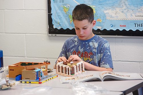 MIKE DEAL / WINNIPEG FREE PRESS
Starbuck School student, Blake Louttit, builds with lego during the noon-hour Lego Club.
Tim Morison, phys-ed teacher at Starbuck School in Starbuck, MB, found in Lego an unlikely cure to workplace burnout and mental health challenges, which began after months of teaching during a pandemic and worsened when he and his wife lost their baby in the spring. Morison opened up to his students about his mental health struggles and shared his coping mechanism: building Lego with his three-year-old at home and alone, with them. His students&#x560;receptiveness has since sparked the launch of a Lego club at Starbuck School. On Mondays and Tuesdays, the phys-ed teacher forfeits his lunch hour to spend time with K-8 students and colourful blocks. They&#x576;e done significant fundraising to purchase toys and accepted donations from community members.
See Maggie Macintosh story
230130 - Monday, January 30, 2023.