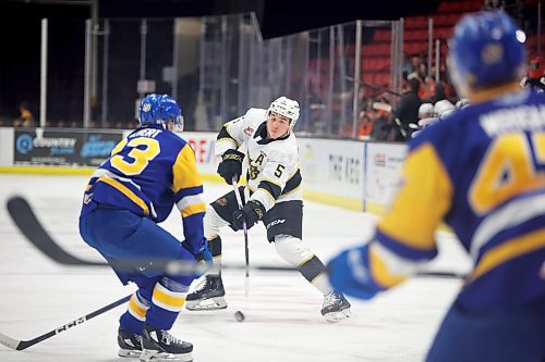 Logen Hammett (5) of the Brandon Wheat Kings fires a shot during Western Hockey League action against the Saskatoon Blades at Westoba Place on Tuesday evening. (Tim Smith/The Brandon Sun) 