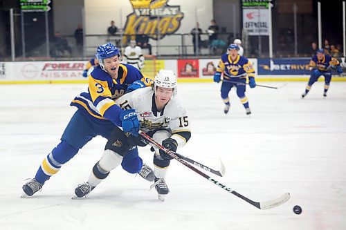 31012022
Blake Gustafson #3 of the Saskatoon Blades knocks the puck away from Nolan Ritchie #15 of the Brandon Wheat Kings during WHL action at Westoba Place on Tuesday evening. 
(Tim Smith/The Brandon Sun)