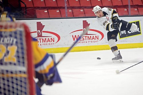 31012022
Dawson Pasternak #88 of the Brandon Wheat Kings fires a shot on netminder Austin Elliott #31 of the Saskatoon Blades during WHL action at Westoba Place on Tuesday evening. 
(Tim Smith/The Brandon Sun)