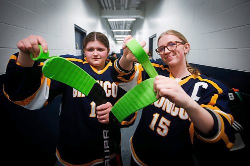 JOHN WOODS / WINNIPEG FREE PRESS
JH Bruns Broncos&#x2019; Kadence Morin (10), left, and Emma-Rae Wallis (15) with green tape on their sticks before high school action against the Garden City Gophers at JH Bruns high school in Winnipeg on Monday, January 23, 2023. The green tape on the sticks is an initiative called Buddy Check for Jesse to help create awareness for mental health in youth sport.

Re: Sanderson