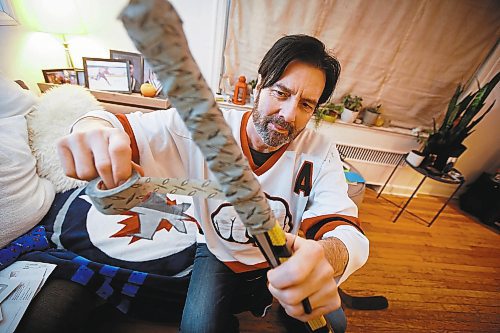 JOHN WOODS / WINNIPEG FREE PRESS
Jeff Einfeld, a beer league hockey player who has been taping his stick the same way since he was a kid, with a wooden stick, is photographed in his home Tuesday, January 31, 2023. 

Re: Sanderson