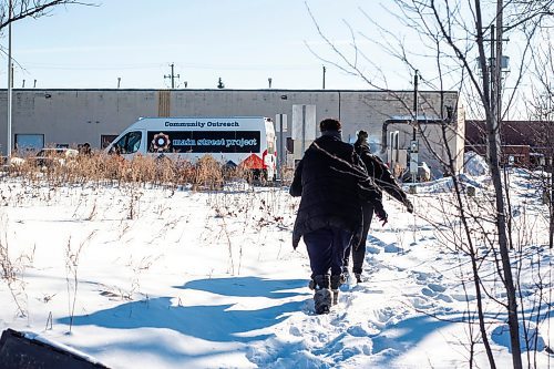 MIKAELA MACKENZIE / WINNIPEG FREE PRESS

Case worker Robin Eastman checks to see if anyone is around at a camp to offer sandwiches, warm socks, water, and other supplies from the Main Street Project van in Winnipeg on Wednesday, Feb. 1, 2023. For Tyler story.

Winnipeg Free Press 2023.