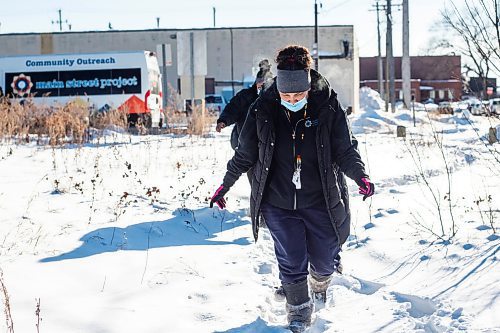 MIKAELA MACKENZIE / WINNIPEG FREE PRESS

Case worker Robin Eastman checks to see if anyone is around at a camp to offer sandwiches, warm socks, water, and other supplies from the Main Street Project van in Winnipeg on Wednesday, Feb. 1, 2023. For Tyler story.

Winnipeg Free Press 2023.