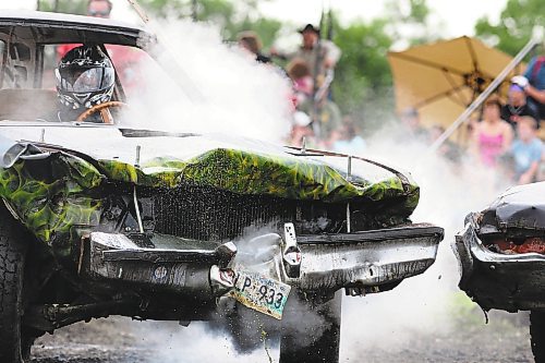 Brandon Sun A competitor in Darbie's Demo Derby springs a major radiator leak Sunday at the Boissevain Fairgrounds. Proceeds from the event went to Bill and Bonnie Unrau, whose son Joshua was born with a serious heart defect. (James O'Connor/Brandon Sun)