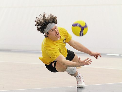 Jens Watt dives for a ball during Brandon University men's volleyball practice on Thursday. (Thomas Friesen/The Brandon Sun)