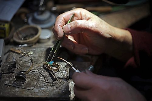 02022023
Longtime Brandon goldsmith Dat Tao works on refinishing a ring in his workshop at TCM Goldsmith in downtown Brandon. (Tim Smith/The Brandon Sun)
