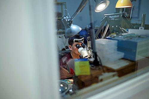 02022023
Dat Tao, owner of TCM Goldsmith on Rosser Avenue in downtown Brandon, looks through a magnifier while working on repairing a ring in his workshop. (Tim Smith/The Brandon Sun)
