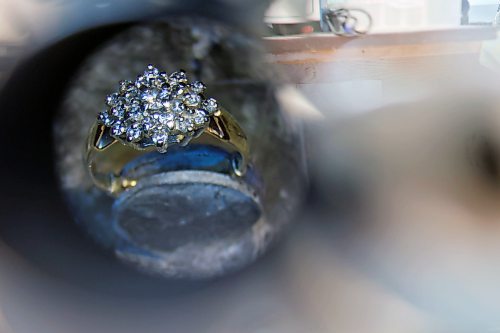 02022023
A ring is seen through a magnifier in Dat Tao’s workshop at TCM Goldsmith in downtown Brandon. (Tim Smith/The Brandon Sun)
