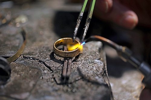 02022023
Longtime Brandon goldsmith Dat Tao works on refinishing a ring in his workshop at TCM Goldsmith in downtown Brandon. (Tim Smith/The Brandon Sun)
